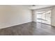 Cozy room features wood flooring and sliding glass door to the back patio at 3337 Irv Marcus Dr, Las Vegas, NV 89108