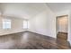 Bright and spacious living room featuring wood-look floors and ample natural light at 3337 Irv Marcus Dr, Las Vegas, NV 89108