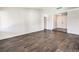 Bright and spacious living room featuring wood-look floors and ample natural light at 3337 Irv Marcus Dr, Las Vegas, NV 89108