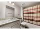 Modern bathroom with a shower-tub combination, vanity, granite countertops, and a large mirror at 378 Colleen Ct # G, Mesquite, NV 89027