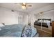 Bedroom view featuring a ceiling fan, mirrored closet doors, and ensuite bath at 378 Colleen Ct # G, Mesquite, NV 89027