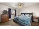 Comfortable bedroom with soft lighting from a ceiling fan and window at 378 Colleen Ct # G, Mesquite, NV 89027