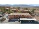 Aerial view of a two-story, terracotta-roofed apartment building with covered parking and desert landscaping in a scenic area at 378 Colleen Ct # G, Mesquite, NV 89027