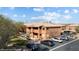 Exterior view of a two-story apartment building with ample parking, visitor spaces, and desert landscaping at 378 Colleen Ct # G, Mesquite, NV 89027