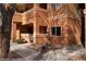 Beautiful multi-story building with a light brown exterior and well maintained landscaping at 378 Colleen Ct # G, Mesquite, NV 89027
