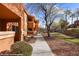 Exterior of apartment building with landscaped walkways and palm trees at 378 Colleen Ct # G, Mesquite, NV 89027