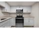 Modern kitchen featuring stainless steel appliances, sleek design, and granite countertops and cabinets at 378 Colleen Ct # G, Mesquite, NV 89027