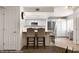 Modern kitchen featuring an island with bar seating, stainless steel appliances, and neutral color palette at 378 Colleen Ct # G, Mesquite, NV 89027