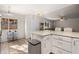 Spacious kitchen with granite countertops, modern appliances, tile floors, and access to a living area at 378 Colleen Ct # G, Mesquite, NV 89027