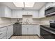 Well-lit kitchen with stainless steel appliances, granite countertops, modern cabinets, and a sleek design at 378 Colleen Ct # G, Mesquite, NV 89027