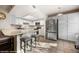 Contemporary kitchen with stainless steel appliances, a breakfast bar, and ample cabinet space at 378 Colleen Ct # G, Mesquite, NV 89027