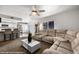 Open-concept living room with bar stool seating and a comfortable sectional sofa at 378 Colleen Ct # G, Mesquite, NV 89027