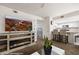 Open living space with entertainment center, adjacent kitchen and bar stool seating at 378 Colleen Ct # G, Mesquite, NV 89027
