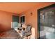 Cozy patio space with chairs and a small table, inviting outdoor relaxation at 378 Colleen Ct # G, Mesquite, NV 89027