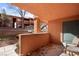 A partially covered outdoor patio with seating and a view of the community at 378 Colleen Ct # G, Mesquite, NV 89027