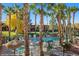Pool area has plenty of seating with beautiful trees and greenery at 378 Colleen Ct # G, Mesquite, NV 89027