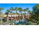 Community pool surrounded by palm trees and desert landscaping at 378 Colleen Ct # G, Mesquite, NV 89027
