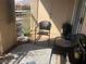 Relaxing balcony space with outdoor seating, offering a private retreat with a cozy rug at 3850 Juno Beach St # 203, Las Vegas, NV 89129