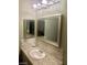 Stylish bathroom featuring a modern vanity, elegant backsplash, and well-lit mirror at 3850 Juno Beach St # 203, Las Vegas, NV 89129