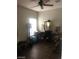 Versatile bedroom showcasing ample space for a home gym and office setup, with hardwood floors at 3850 Juno Beach St # 203, Las Vegas, NV 89129