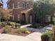 Inviting two-story home featuring meticulously maintained landscaping, walkway, and charming curb appeal at 3850 Juno Beach St # 203, Las Vegas, NV 89129