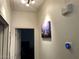 Bright hallway with modern thermostat and attractive artwork at 3850 Juno Beach St # 203, Las Vegas, NV 89129