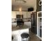 Stylish kitchen with granite countertops, stainless steel appliances and ample cabinet space at 3850 Juno Beach St # 203, Las Vegas, NV 89129