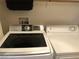 Modern laundry area with a front-loading washer and dryer set at 3850 Juno Beach St # 203, Las Vegas, NV 89129