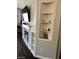 Cozy living room with an electric fireplace, hardwood floors and built in shelving at 3850 Juno Beach St # 203, Las Vegas, NV 89129