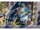 Aerial of landscaped community pool, spa, and parking with mature palms at 5155 W Tropicana Ave # 1173, Las Vegas, NV 89103