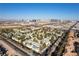 Aerial view of a community with lush trees and cityscape in the background at 5155 W Tropicana Ave # 1173, Las Vegas, NV 89103