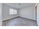 Bedroom featuring wood floors and a bright window at 5301 Padua Way, Las Vegas, NV 89107