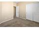 Bedroom with sliding closet door and neutral carpet at 6360 Bullring Ln, Las Vegas, NV 89130