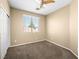 Bedroom featuring a ceiling fan and a large window at 6360 Bullring Ln, Las Vegas, NV 89130