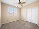 Well-lit bedroom with a window and a closet at 6360 Bullring Ln, Las Vegas, NV 89130