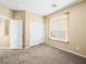 Cozy bedroom with carpeted floors and a bright window providing a comfortable retreat at 6360 Bullring Ln, Las Vegas, NV 89130