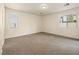 Bright, carpeted bedroom with two windows allowing natural light at 6360 Bullring Ln, Las Vegas, NV 89130