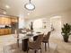 Elegant dining room with modern table, chairs, and seamless access to adjacent rooms at 6360 Bullring Ln, Las Vegas, NV 89130