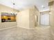 Bright living area offering ample space, neutral colors, and seamless access to the adjacent kitchen at 6360 Bullring Ln, Las Vegas, NV 89130