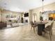 Spacious living room featuring fireplace, ample seating, and bright natural light at 6360 Bullring Ln, Las Vegas, NV 89130