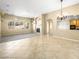 Open living space with fireplace, natural light, and seamless flow to dining area at 6360 Bullring Ln, Las Vegas, NV 89130