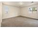 Spacious room featuring neutral walls and two windows at 6360 Bullring Ln, Las Vegas, NV 89130