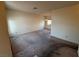 Bright living room with ample space, carpet flooring and natural light from a large window at 6388 Canyon Dawn Ave, Las Vegas, NV 89108