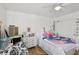 Brightly lit bedroom with laminate flooring and a ceiling fan at 6527 Netherseal Ave, Las Vegas, NV 89139