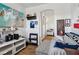 Cozy bedroom featuring art displays, wood floors, and a comfortable seating area at 6527 Netherseal Ave, Las Vegas, NV 89139