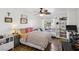 Cozy bedroom featuring wood flooring, large windows, and a comfortable sleeping and relaxation space at 6527 Netherseal Ave, Las Vegas, NV 89139