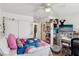 Bedroom with closet, and desk with a TV at 6527 Netherseal Ave, Las Vegas, NV 89139