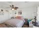 Comfortable bedroom with a ceiling fan and a well-lit space, great for relaxing at 6527 Netherseal Ave, Las Vegas, NV 89139
