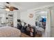 Bedroom featuring an exercise bike, desk area, and wood floors at 6527 Netherseal Ave, Las Vegas, NV 89139
