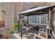 Patio with gazebo covering a table and chairs at 6527 Netherseal Ave, Las Vegas, NV 89139